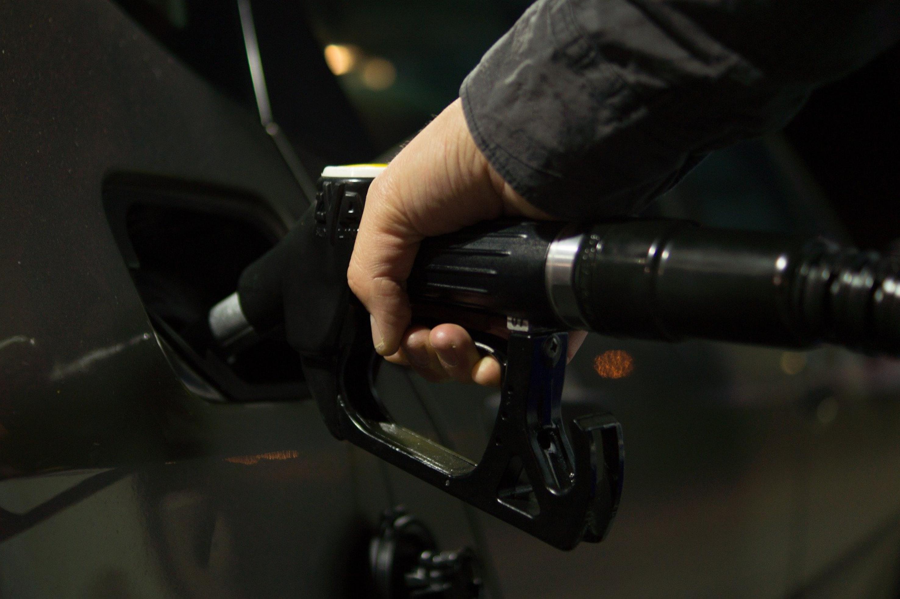 Image of person filling a vehicle with fuel