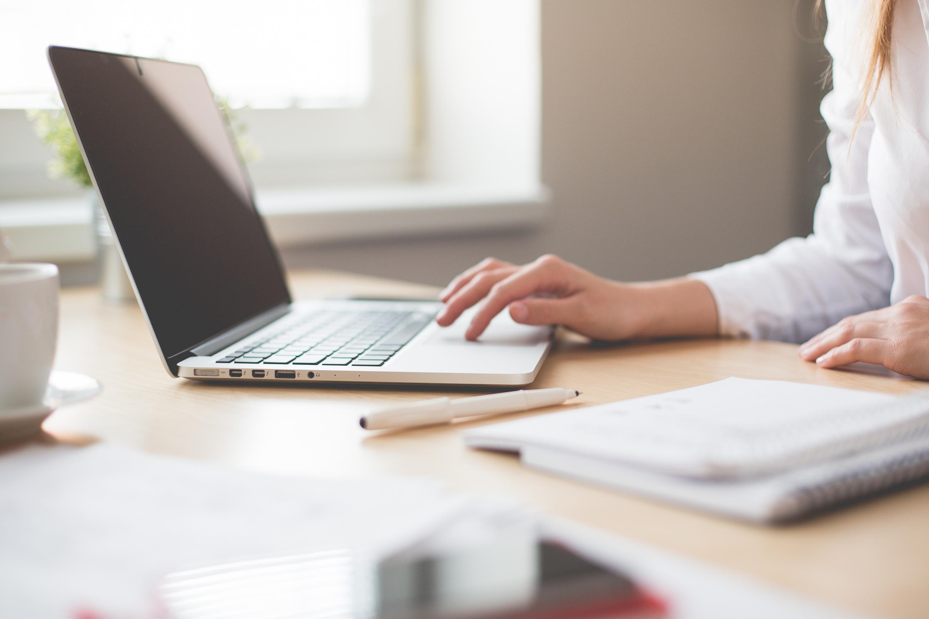Image of person working on a laptop