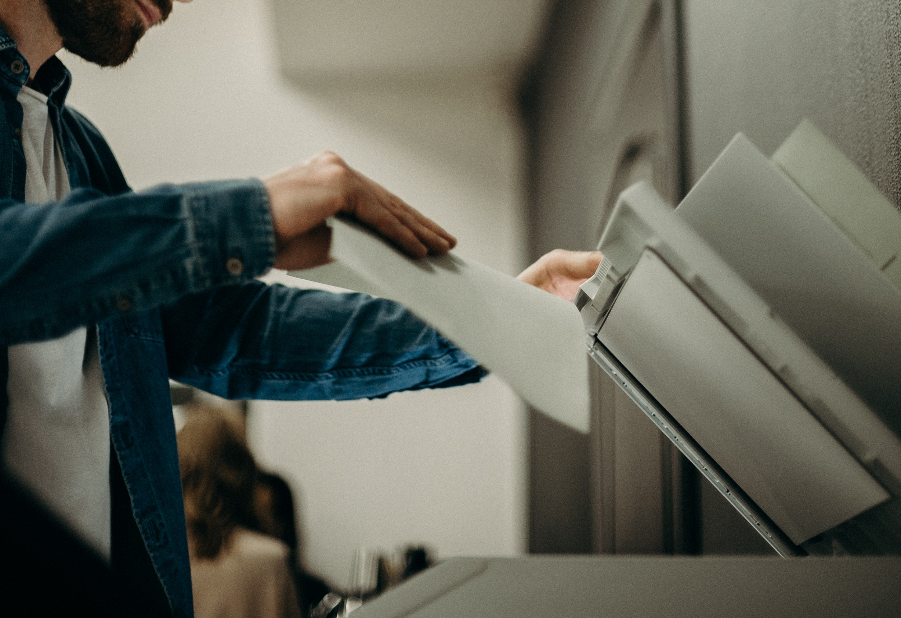 Image of person using a photocopier